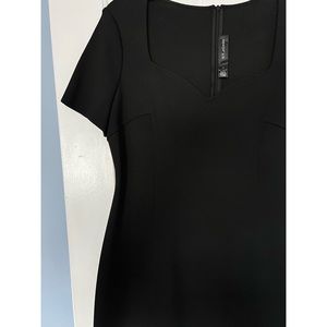 St.John size 12 black dress. Never been worn.